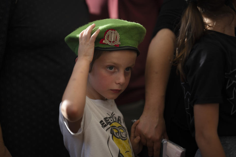 The son of reservist Staff Sergeant Rafael Kauders mourns during his funeral at a cemetery in the West Bank settlement of Kfar Etzion, Thursday, June 6, 2024. Kauders, 39, was killed during a drone attack launched by the Lebanese militant group Hezbollah toward a gathering of military officials at a village in northern Israel.(AP Photo/Leo Correa)