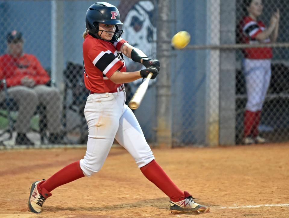 Palmetto High's Emily Borresen knocks in two runs with a hit in the sixth inning against Braden River High at the Pirates softball field. The Tigers won the game, 7-1.