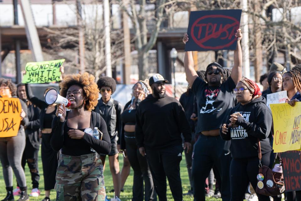 Western Kentucky University senior Tani Washington leads a group of students in chants to protest Kyle Rittenhouse’s talk on campus on Wednesday, March 27, 2024.