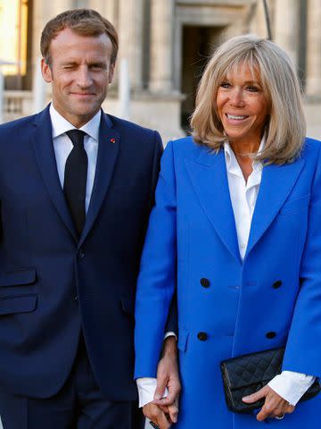 <p>Chesnot/Getty</p> Emmanuel Macron and Brigitte Macon prior to the inauguration of the exhibition "Paris-Athens. Birth of Modern Greece "at the Louvre Museum on September 27, 2021.