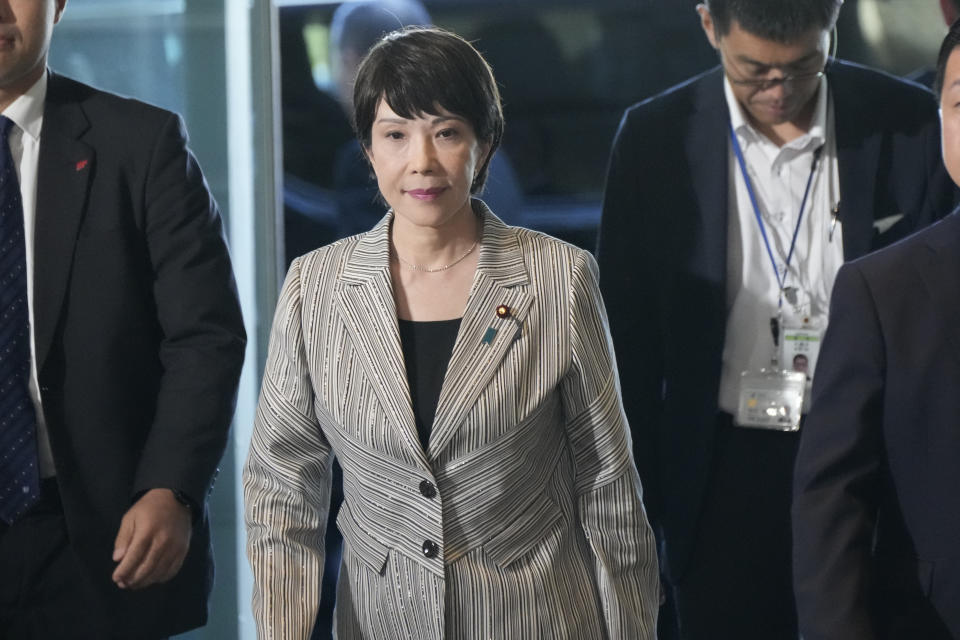 Economic Security Minister Sanae Takaichi, center, arrives at the prime minister's office Wednesday, Sept. 13, 2023, in Tokyo, Japan. Prime Minister Fumio Kishida is shuffling his Cabinet and key party posts Wednesday in an apparent attempt to balance power within the governing party and strengthen his position before a leadership vote next year.(AP Photo/Eugene Hoshiko)