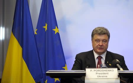 Ukrainian President Petro Poroshenko holds a news conference at the European Council headquarters during an EU summit in Brussels August 30, 2014. REUTERS/Laurent Dubrule