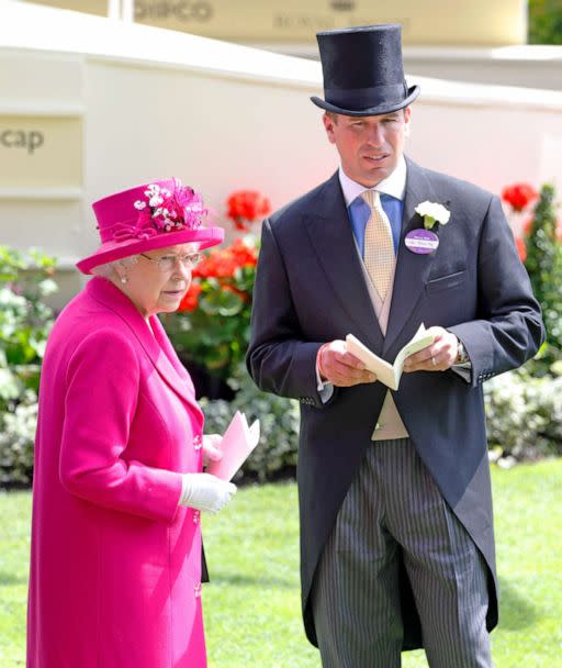 PHOTO: Queen Elizabeth II and her grandson Peter Phillips watch the horses in the parade ring on Day 4 of Royal Ascot at Ascot Racecourse on June 20, 2014 in Ascot, England. (Max Mumby/Indigo via Getty Images, FILE)