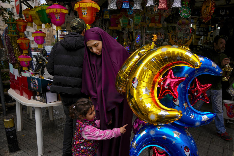 People shop for decorations for the Muslim holy month of Ramadan at a shop in Beirut, Lebanon, Saturday, March 9, 2024. (AP Photo/Bilal Hussein)