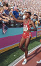 LOS ANGELES, CA - AUG 6 1984: Carl Lewis of the USA celebrates his gold medal win in the Long Jump final during the 1984 Olympic Games. Lewis won the gold medal with a jump of 8. 54 metres at the Colliseum Stadium on August 6, 1984 in Los Angeles. (Photo by Tony Duffy / Getty Images ) 