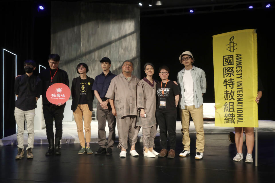 Lit Ming-wai, second from right, and performers pose on the stage of drama "May 35th" in Taipei, Taiwan, Thursday, June 1, 2023. This Sunday, June 4, 2023 will mark the 34th anniversary of China's 1989 crackdown on pro-democracy protesters at Beijing's Tiananmen Square. Though local commemoration appeared to be muted, many members of the Hong Kong diaspora are committed to keeping the flames alive overseas. (AP Photo/Chiang Ying-ying)