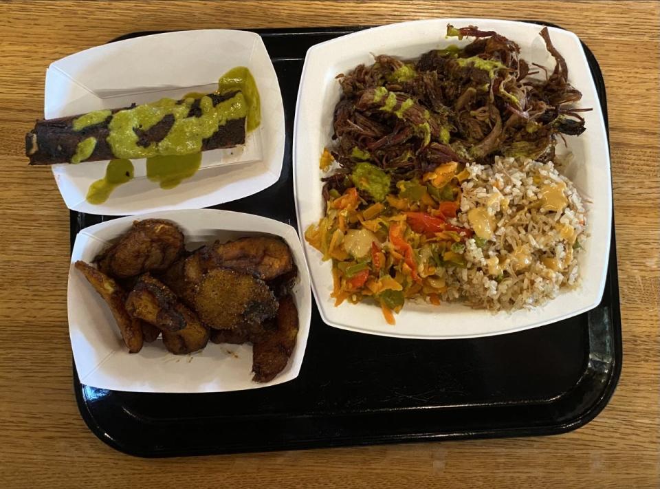 Sub-Saharan brisket meal, deep fried sweet plantains and smoked pork rib from Edie's Grill.