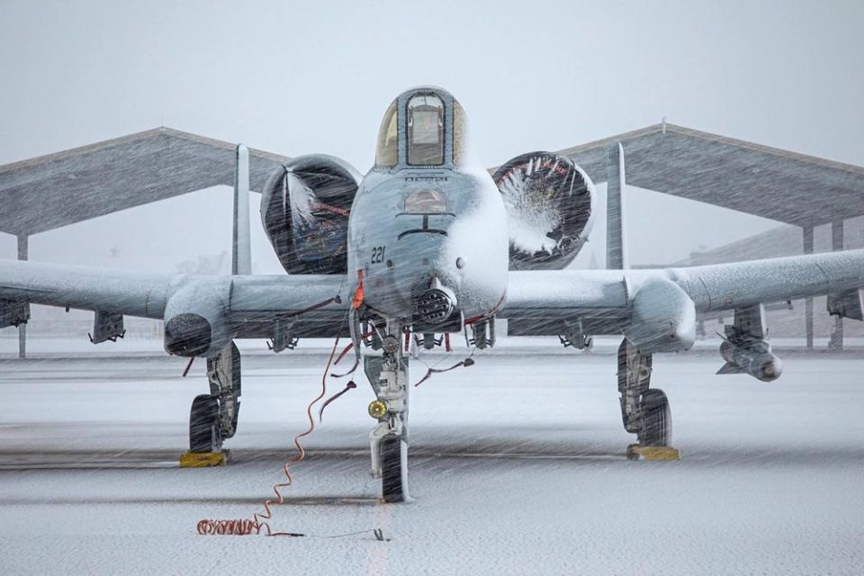 The front of an aircraft is shown during a snowstorm