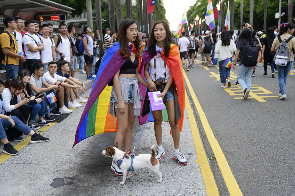 TAIPEI CITY, TAIPEI, TAIWAN - 2019/10/26: Two girls holding hands while taking part at the Taipei LGBT Pride parade. This year is the first parade of this kind held after the government in Taiwan formally legalized same sex marriage. The parade has attracted over 250,000 people making it the largest in Asia. (Photo by Alberto Buzzola/LightRocket via Getty Images)