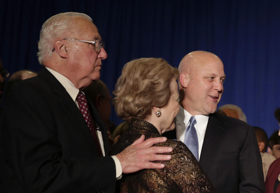 Incumbent New Orleans Mayor Mitch Landrieu is greeted by his parents, former Mayor Moon Landrieu and his wife Verna Landrieu, as he arrives to address supporters after winning reelection in New Orleans, Saturday, Feb. 1, 2014. (AP Photo/Gerald Herbert)