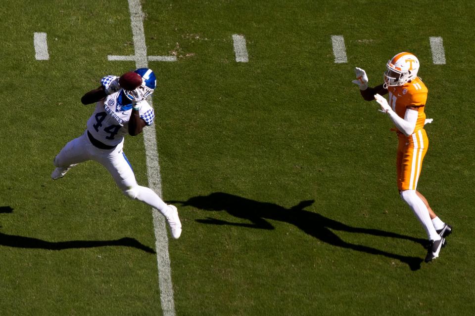 Kentucky linebacker Jamin Davis (44) intercepts a pass intended for Tennessee wide receiver Jalin Hyatt (11) during a SEC conference football game between the Tennessee Volunteers and the Kentucky Wildcats held at Neyland Stadium in Knoxville, Tenn., on Saturday, October 17, 2020.