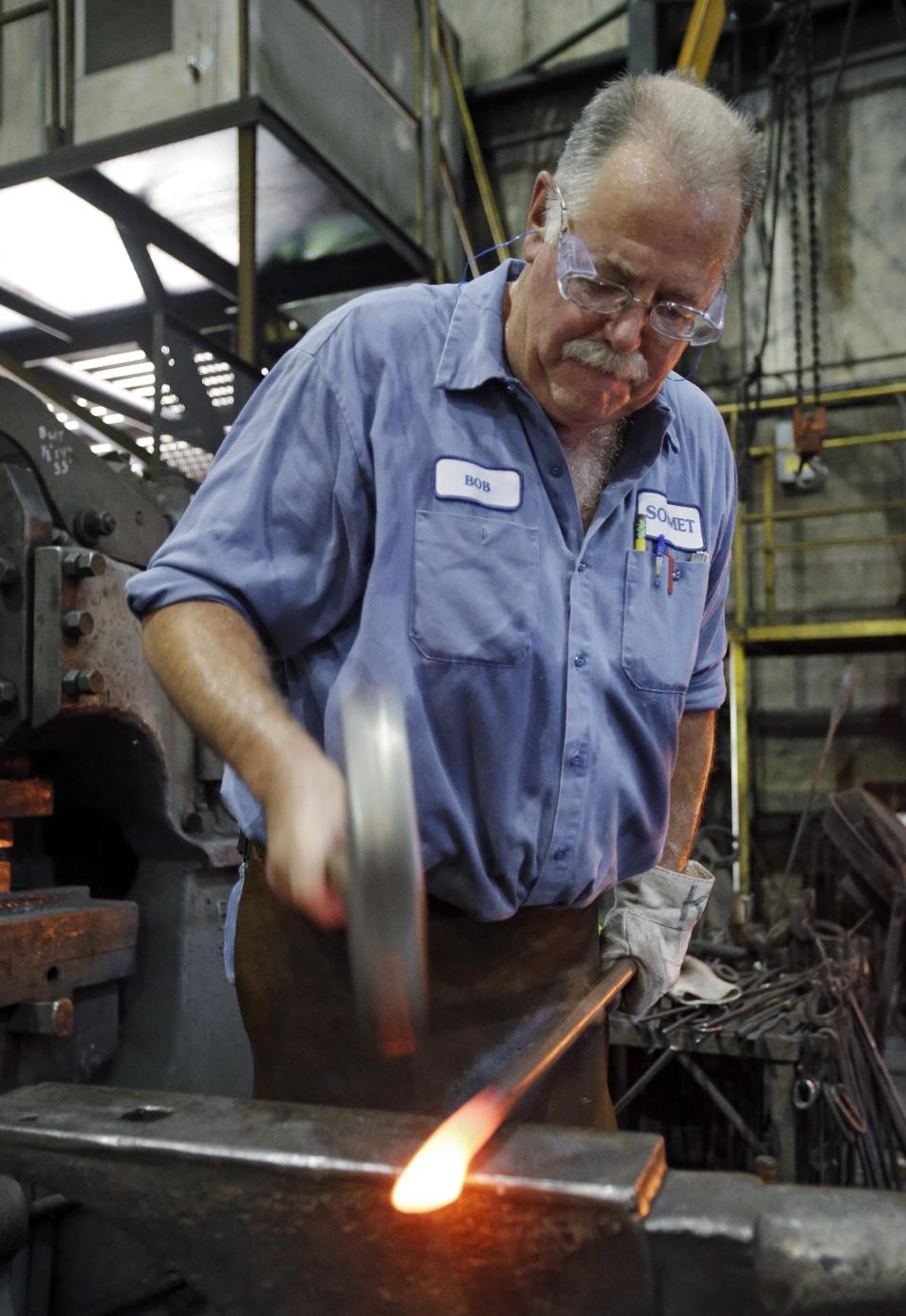 In this Thursday, Sept. 6, 2012, photo, Bob Kurz shapes a pry bar at Solmet Technologies in Canton, Ohio. U.S. manufacturing grew for the first time in four months, buoyed by a jump in new orders in September. The increase was a hopeful sign that the economy is improving. The Institute for Supply Management, a trade group of purchasing managers, said Monday, Oct. 1, 2012, that its index of factory activity rose to 51.5. That's up from 49.6 in August. (AP Photo/Mark Duncan)