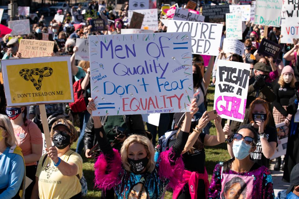 Protestors rally during the Women's March at Freedom Plaza, Saturday, Oct. 17, 2020, in Washington. (AP Photo/Jose Luis Magana)
