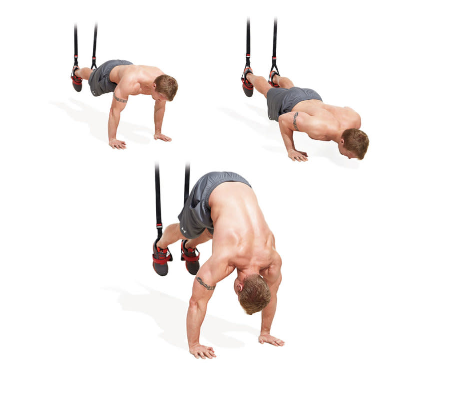 How to do it:<ul><li>Attach the suspension trainer to a sturdy object overhead, and lower the foot cradles to about knee height (you want your body to be in a straight line when you rest your feet in them).</li><li>Get into pushup position with your feet in the cradles and hands placed shoulder width on the floor.</li><li>Keeping your abs braced, lower your body until your chest is just above the floor and then push back up.</li><li>Now bend your hips and raise them into the air until your torso is vertical.</li><li>Straighten your body again. That’s one rep.</li></ul>
