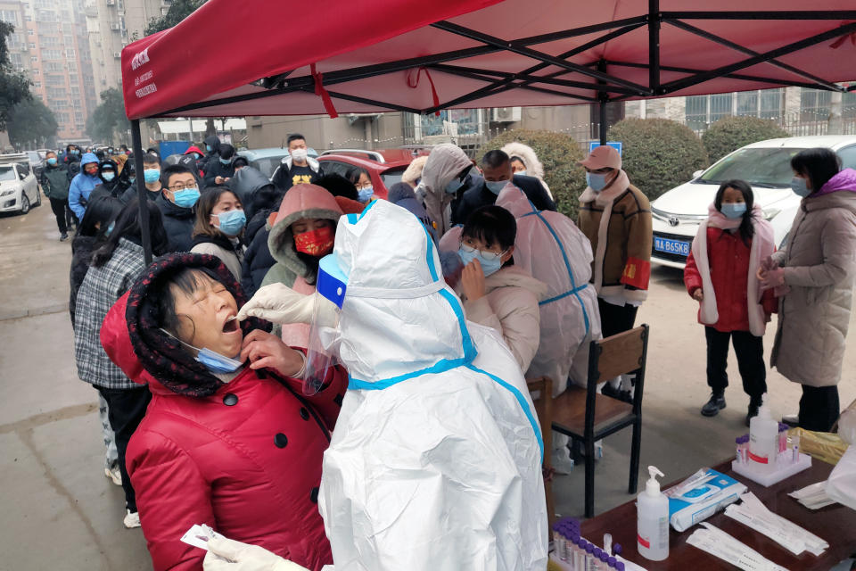 Workers give residents a second round of nucleic acid testing as Anyang becomes the third Chinese city in Covid lockdown.
