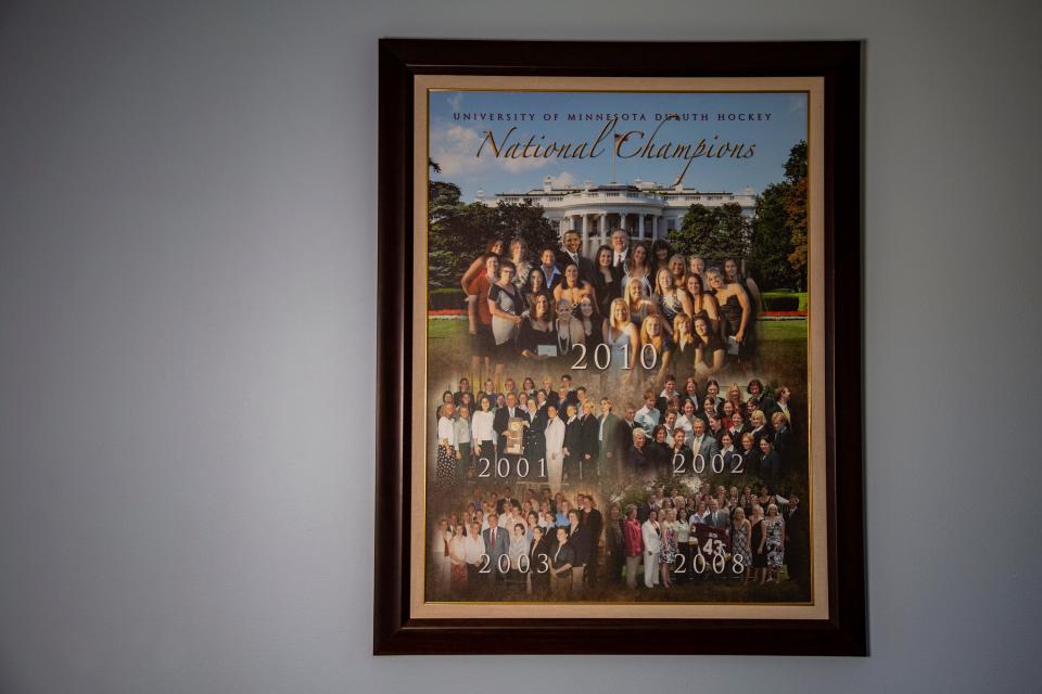 A framed photo shows Shannon Miller with her five different national championship winning hockey teams at the White House at her home in Palm Springs, Calif., Friday, Feb. 11, 2022.