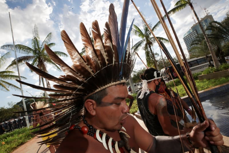 Indigenous Brazilians take part in a protest to defend the demarcation of indigenous lands, in Brasilia