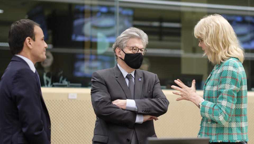 BRUSSELS, BELGIUM - MAY 27: French Secretary of State for the Digital Sector, Cedric O (L), is speaking with EU Internal Market Commissioner Thierry Breton (C) and Dutch Secretary of State for Social Affairs Economics and Climate Policy, Maria Cornelia Gezina. 