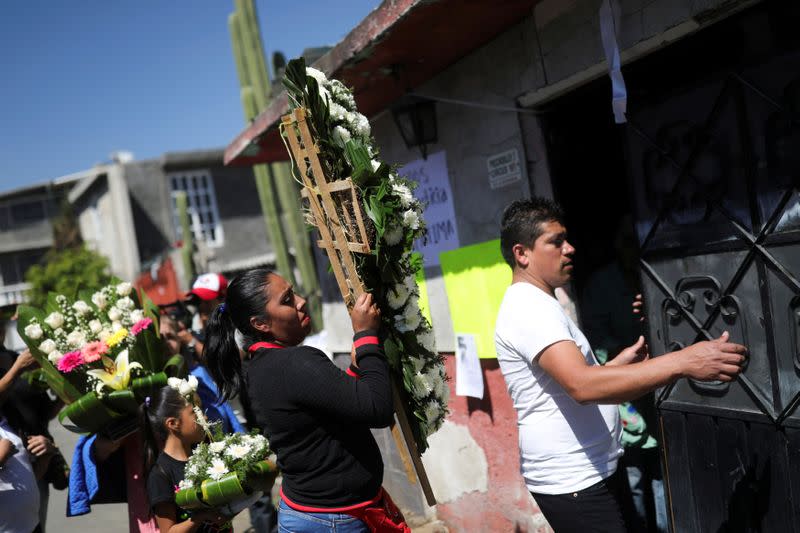 People arrive at the home of seven-year-old Fatima Cecilia Aldrighett, who went missing on February 11 and whose body was discovered over the weekend inside a plastic garbage bag, in Mexico City