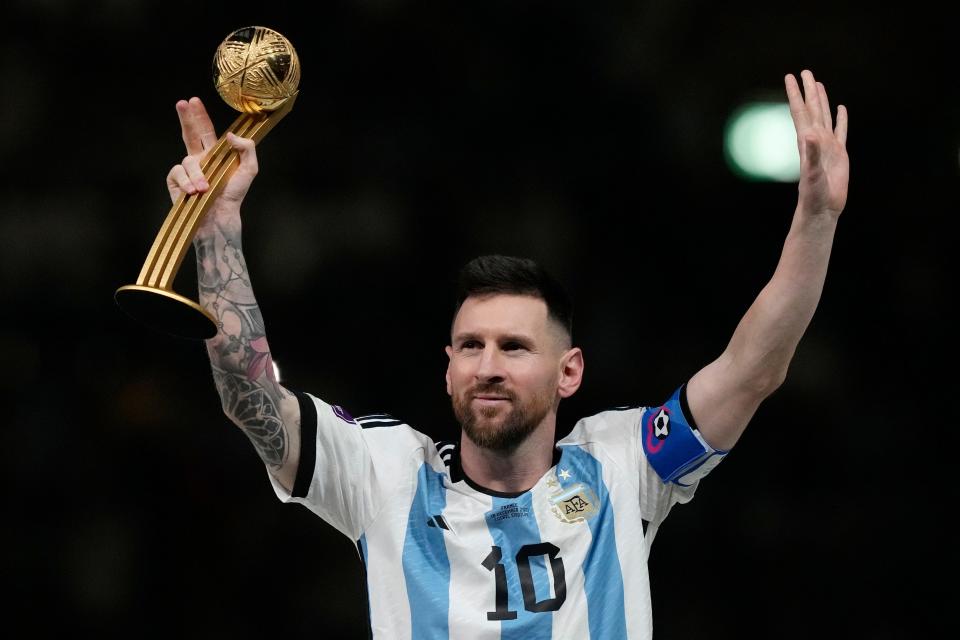 Argentina's Lionel Messi waves after receiving the Golden Ball award for best player of the tournament at the end of the World Cup final soccer match between Argentina and France at the Lusail Stadium in Lusail, Qatar, Sunday, Dec. 18, 2022.