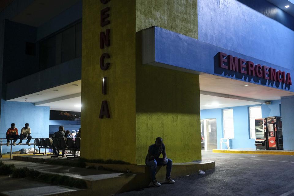A Haitian migrant waits for his pregnant wife who went into labor, at the Nuestra Senora de la Altagracia Maternity Hospital, in Santo Domingo, Dominican Republic, Tuesday, Nov. 23, 2021. Haitian officials and activists say the government is violating laws and agreements by deporting pregnant women, separating children from parents and arresting people between 6 p.m. and 6 a.m. as President Luis Abinader has unleashed a flurry of anti-Haitian actions. (AP Photo/Matias Delacroix)