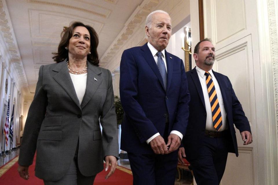 U.S. President Joe Biden reacts as he arrive between Vice President Kamala Harris and Jeff Say, father of three who has experienced the difficulty of limited broadband access in rural America, to speak on high-speed internet infrastructure in the East Room at the White House in Washington on June 26.