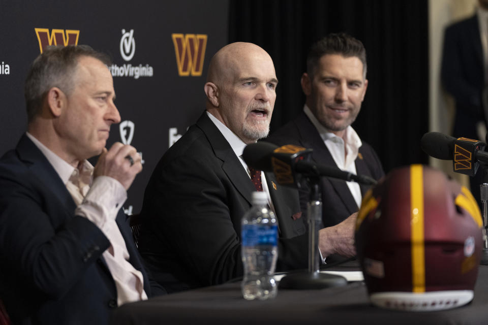 Washington Commanders new head coach Dan Quinn, center, with Commanders managing partner Josh Harris, left, and general manager Adam Peters, right, speaks during an NFL football news conference at Commanders Park in Ashburn, Va., Monday, Feb. 5, 2024. (AP Photo/Manuel Balce Ceneta)