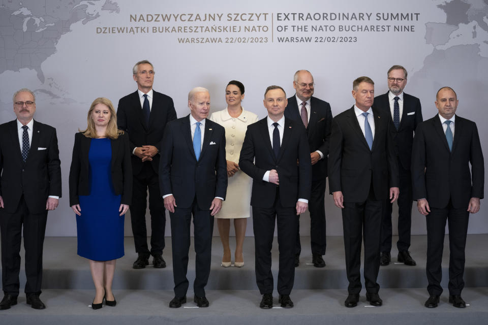 President Joe Biden participates in a family photo during a meeting with the leaders of the Bucharest Nine, a group of nine countries that make up the eastern flank of NATO, Wednesday, Feb. 22, 2023, in Warsaw. From left are Latvian President Egils Levits, Slovakia President Suzana Caputova, NATO Secretary General Jens Stoltenberg, Biden, Hungarian President Katalin Novák, Polish President Andrzej Duda, Estonia President Alar Karis, Romania President Klaus Werner Iohannis, Czech Republic Prime Minister Petr Fiala, Bulgaria President Ruman Radev and Lithuania President Gitanas Nauseda. (AP Photo/ Evan Vucci)