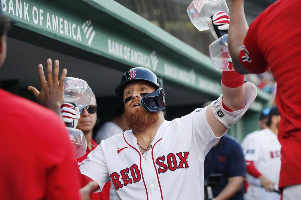 Boston Red Sox's Justin Turner celebrates after his solo home run during the fourth inning of a baseball game against the Los Angeles Dodgers, Saturday, Aug. 26, 2023, in Boston. (AP Photo/Michael Dwyer)