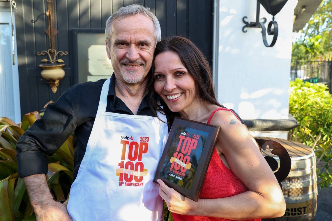 Klime and Anita Kovaceski of Crust show off the plaque commemorating their appearance on Yelp’s Top 100 Restaurants list for 2023.