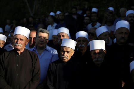 FILE PHOTO: Members of the Druze community attend the funeral of Israeli Druze police officer Kamil Shanan in the village of Hurfeish, Israel July 14 2017 REUTERS/Ammar Awad/File Photo