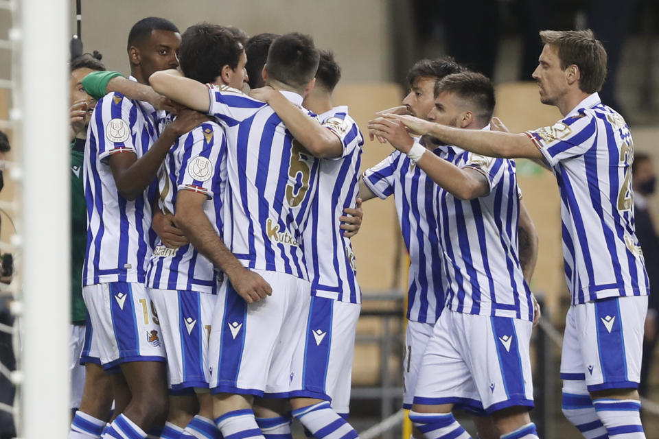 Real Sociedad players celebrate scoring their side's first goal during the final of the 2020 Copa del Rey, or King's Cup, soccer match between Athletic Bilbao and Real Sociedad at Estadio de La Cartuja in Sevilla, Spain, Saturday April 3, 2021. The game is the rescheduled final of the 2019-2020 competition which was originally postponed due to the coronavirus pandemic. (AP Photo/Angel Fernandez)