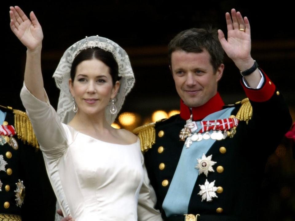 Crown Princess Mary and Crown Prince Frederik of Denmark wave from the balcony of Christian VII’s Palace after their wedding on 14 May, 2004 in Copenhagen, Denmark (Ian Waldie/Getty)