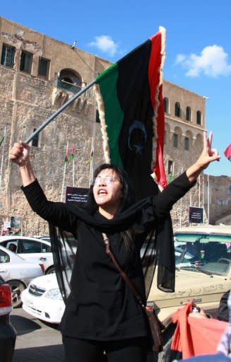 A Libyan woman celebrates the capture of Seif al-Islam, fugitive son and one-time heir apparent of murdered leader Moamer Kadhafi, in the capital Tripol