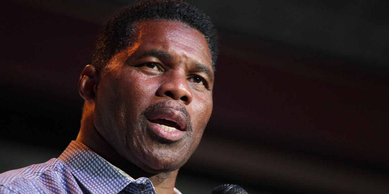 Herschel Walker against black background.