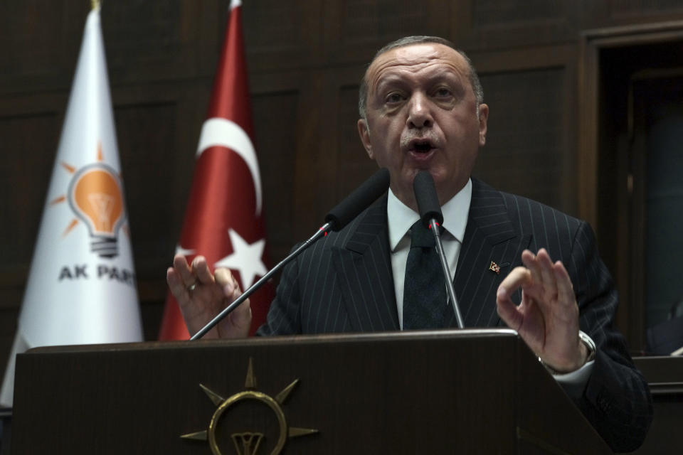 Turkey's President Recep Tayyip Erdogan addresses his ruling party MPs, in Ankara, Turkey, Tuesday, June 25, 2019, two days after Ekrem Imamoglu, the candidate of the secular opposition Republican People's Party won the election for mayor of Istanbul. Erdogan addressed his AK Party's weekly meeting, the first time he speaks since the Istanbul mayoral election Sunday, which was a big setback for him and his party.(AP Photo/Burhan Ozbilici)