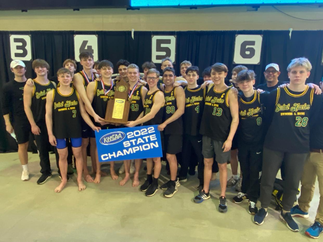 St. Xavier's swim and dive team celebrates winning its 34th straight state championship on Friday Feb. 18, 2022  at Lancaster Aquatic Center in Lexington