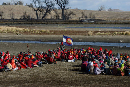 Protesters stage a sit down demonstration against plans to pass the Dakota Access pipeline near the Standing Rock Indian Reservation, near Cannon Ball, North Dakota, U.S. November 18, 2016. REUTERS/Stephanie Keith