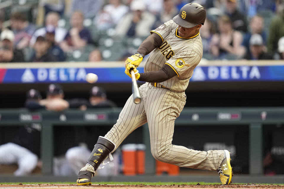 San Diego Padres' Juan Soto hits a single during the second inning of a baseball game against the Minnesota Twins, Tuesday, May 9, 2023, in Minneapolis. (AP Photo/Abbie Parr)