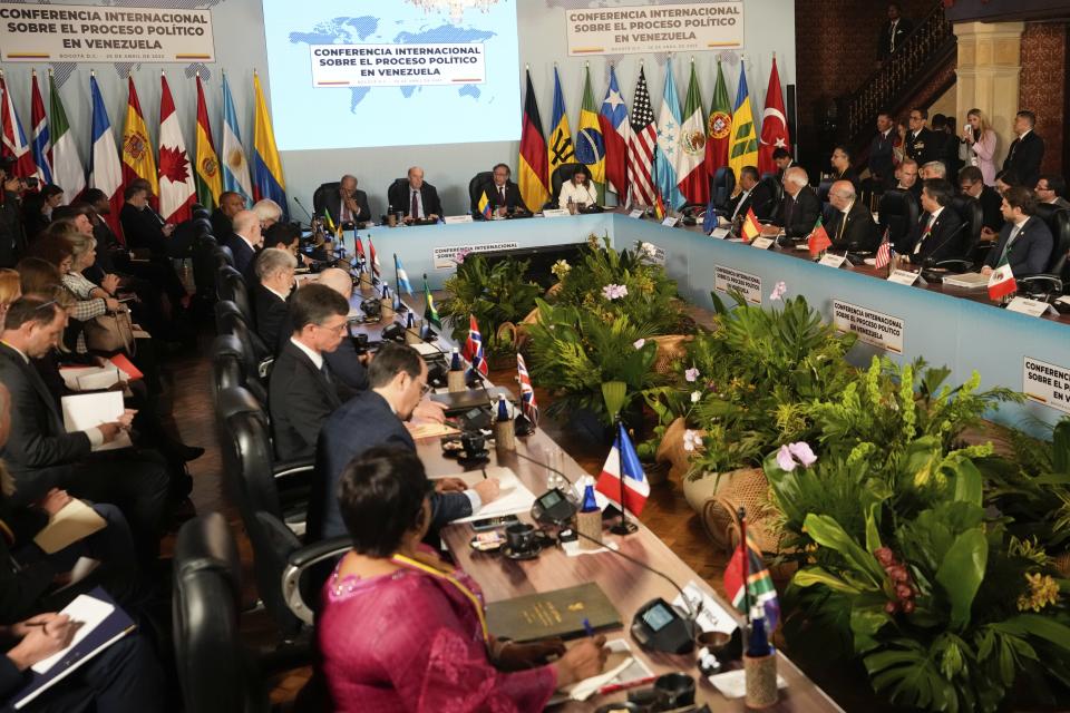 International delegates attend a conference focused on Venezuela's political crisis, at the San Carlos Palace, also known as the Foreign Ministry, in Bogota, Colombia, Tuesday, April 25, 2023. (AP Photo/Fernando Vergara)