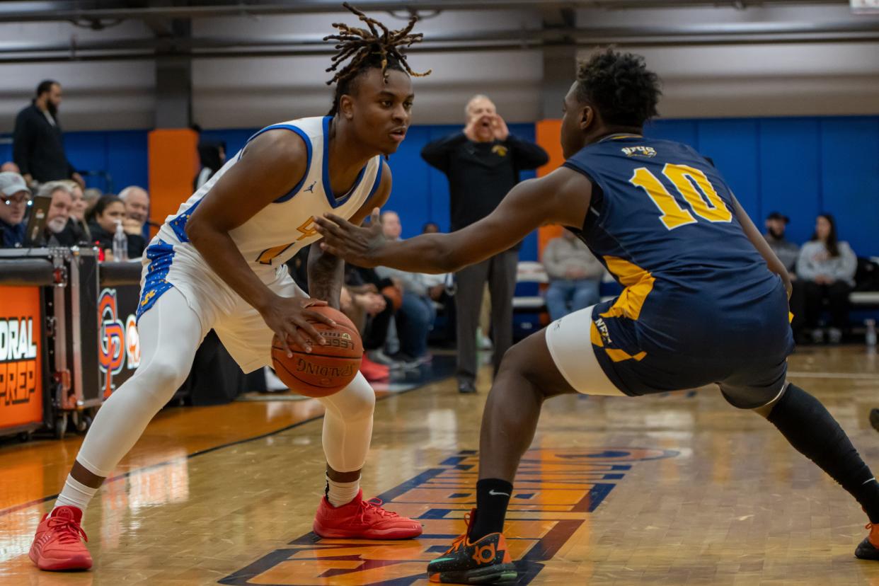 Mikey Crawford (4) looks to make a move on Omarion Ralands (10) in the 2024 Burger King Classic semifinal matchup against Niagara Falls.