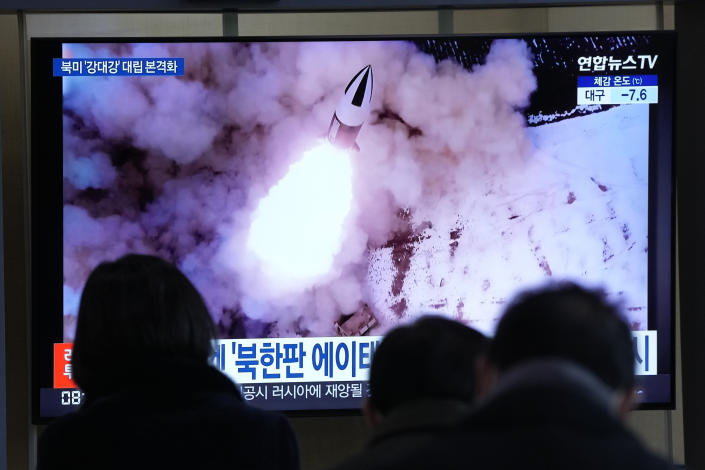 People watch a TV showing a file image of North Korea's missile launch shown during a news program at the Seoul Railway Station in Seoul, South Korea, Thursday, Jan. 20, 2022. Accusing the United States of hostility and threats, North Korea on Thursday said it will consider restarting "all temporally-suspended activities" it had paused during its diplomacy with the Trump administration, in an apparent threat to resume testing of nuclear explosives and long-range missiles. (AP Photo/Ahn Young-joon)