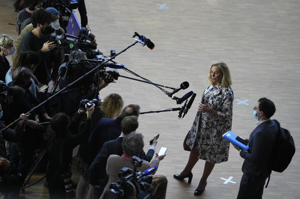 Dutch Finance Minister Sigrid Kaag, second right, speaks with the media as she arrives for a meeting of eurogroup finance ministers at the European Council building in Brussels, Monday, Jan. 17, 2022. Euro finance chiefs hold their first meeting of 2022 in Brussels today facing a challenge that spilled over from last year: surging prices. Inflation in the 19-nation euro area has risen to a record amid an energy-market squeeze while the economic outlook for Europe has dimmed following a recovery in 2021 from the pandemic-induced recession. (AP Photo/Virginia Mayo)