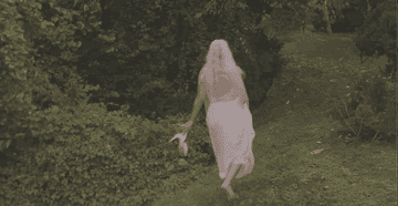 Gigi slips on a muddy embankment and falls in her wedding dress as she's running away from the cameras