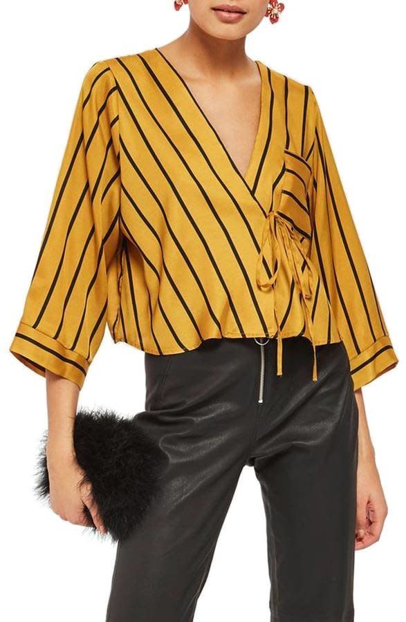 Get it <a href="https://shop.nordstrom.com/s/topshop-stripe-tie-wrap-kimono-top/4871581?origin=category-personalizedsort&amp;fashioncolor=MUSTARD%20MULTI" target="_blank">here</a>.&nbsp;