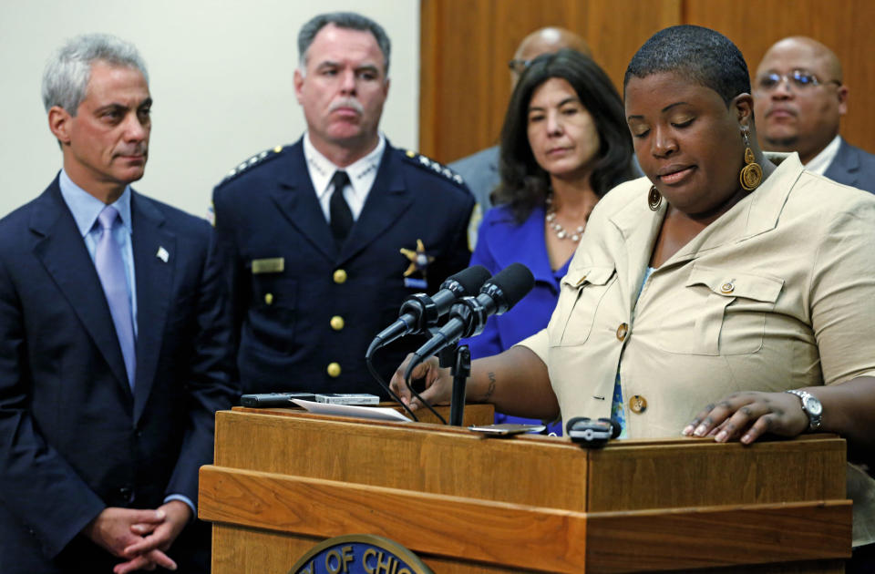 FILE - In this Oct. 15, 2013 file photo, Cleopatra Pendleton, the mother of slain teen Hayida Pendelton, speaks at a news conference about gun violence in Chicago. Looking on from left are Chicago Mayor Rahm Emanuel, Police Superintendent Garry McCarthy and Cook County State's Attorney Anita Alvarez. Fifteen-year-old Hadiya Pendleton was shot and killed Jan. 29, 2013 in a park during a gang dispute she had nothing to do with about a mile from President Barack Obama's Chicago home. Since her death, the number of homicides and other violent crimes that turned Chicago into a national symbol of gun violence have fallen sharply. (AP Photo/M. Spencer Green, File)