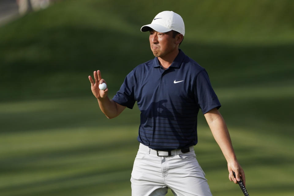 Doug Ghim waves after making a putt on the 14th hole during the third round of The Players Championship golf tournament Saturday, March 13, 2021, in Ponte Vedra Beach, Fla. (AP Photo/John Raoux)