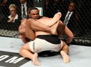 <p>Tyron Woodley of the United States (right) fights against Stephen Thompson of the United States in their welterweight championship bout during the UFC 205 event at Madison Square Garden on November 12, 2016 in New York City. (Photo by Jeff Bottari/Zuffa LLC/Zuffa LLC via Getty Images) </p>