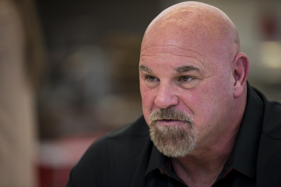 Cardinals offensive line coach Sean Kugler talks to reporters during a news conference in 2019.