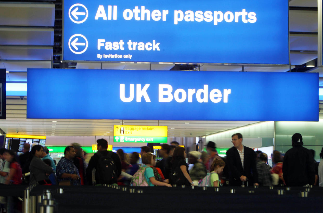 Passengers go through the UK border (PA Wire)